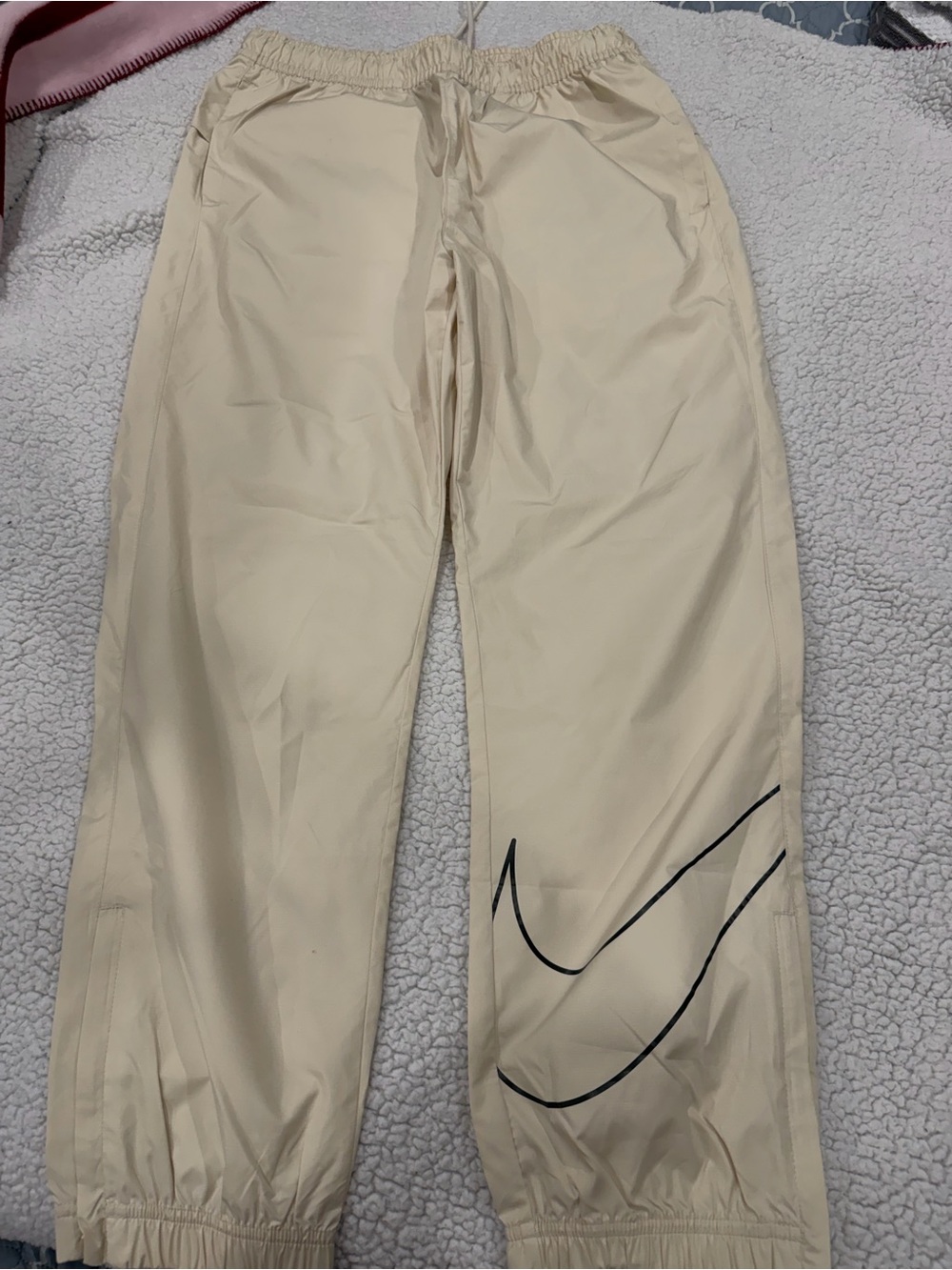 Men's Nike Beige Track Pants with Black Swoosh Detail